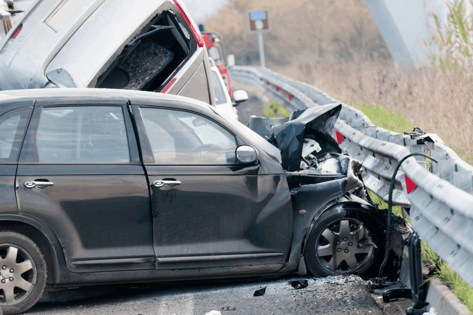 Car collision with guardrail on highway.
